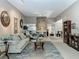 Spacious living room with decorative fireplace, plush furniture and neutral color palette at 103 Red Cedar Dr, Longwood, FL 32779