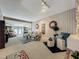 Open living room with track lighting, comfortable seating, and view into dining area at 103 Red Cedar Dr, Longwood, FL 32779