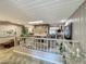 Spacious living room featuring a stone fireplace and a step-down seating area at 103 Red Cedar Dr, Longwood, FL 32779