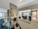 Open-concept layout with stone fireplace, Gathering room, dining area and access to the outside at 103 Red Cedar Dr, Longwood, FL 32779