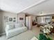 Spacious main bedroom features a sitting area, sliding doors to the patio, and neutral carpet at 103 Red Cedar Dr, Longwood, FL 32779