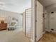 Bright main bedroom showing an accent wall, chair, and screen separating the sleeping space at 103 Red Cedar Dr, Longwood, FL 32779