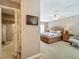 Relaxing main bedroom features a wooden bed frame, a ceiling fan, and neutral carpeting at 103 Red Cedar Dr, Longwood, FL 32779