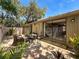 Charming patio features brick pavers, sitting area, and sliding glass doors for indoor-outdoor living at 103 Red Cedar Dr, Longwood, FL 32779