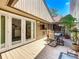 Outdoor patio area with seating, wood decking and easy access to the home's interior at 103 Red Cedar Dr, Longwood, FL 32779