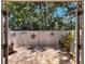 Private outdoor patio featuring patterned brick, a privacy fence, and garden decor at 103 Red Cedar Dr, Longwood, FL 32779