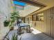 Private outdoor patio area with seating and access through sliding glass doors at 103 Red Cedar Dr, Longwood, FL 32779