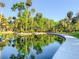 Picturesque water feature surrounded by lush greenery and trees at 103 Red Cedar Dr, Longwood, FL 32779