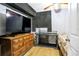 Bedroom featuring soundproofing panels, a ceiling fan and a large tv at 1032 Perkins Rd, Orlando, FL 32809