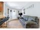 Open living room features a breakfast bar and tile floors at 1032 Perkins Rd, Orlando, FL 32809