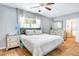 Spacious main bedroom with neutral tones, tile floor, ceiling fan and natural light at 1032 Perkins Rd, Orlando, FL 32809