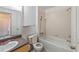 Cozy bathroom with shower-tub combo, toilet, and sink with vanity at 1038 Waterside Dr, Celebration, FL 34747