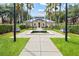Community clubhouse with manicured landscaping, fountain and walkway at 1038 Waterside Dr, Celebration, FL 34747