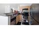 Kitchen featuring stainless steel appliances, light wood cabinets and a breakfast bar at 1038 Waterside Dr, Celebration, FL 34747