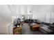 Spacious, well-lit living room area with neutral colored walls, a large sectional, and an entertainment center at 1038 Waterside Dr, Celebration, FL 34747