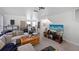 Inviting living room area with a plush couch, media center, and a view into other rooms of the home at 1038 Waterside Dr, Celebration, FL 34747