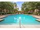 Large community pool with surrounding landscaping and lounge chairs at 1038 Waterside Dr, Celebration, FL 34747