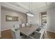 Formal dining room with a large mirror and seating for ten at 10529 Royal Cypress Way, Orlando, FL 32836