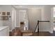 Upstairs hallway leads to various rooms with a view into the downstairs living area at 10529 Royal Cypress Way, Orlando, FL 32836