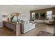 Bright living room with hardwood floors, recessed lights, wood accent wall, and modern decor at 10529 Royal Cypress Way, Orlando, FL 32836