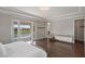 Spacious main bedroom with balcony overlooking water view, and a walk-in closet at 10529 Royal Cypress Way, Orlando, FL 32836