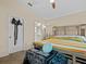 Cozy bedroom featuring neutral walls, carpet, access to the ensuite bathroom and closet space at 1112 Winding Water Way, Clermont, FL 34714