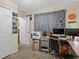 Functional home office featuring a printer, desk, rolling chair and neutral wall paint at 1112 Winding Water Way, Clermont, FL 34714