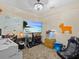 Functional office space with a large whiteboard, desk, fish tank and comfortable seating at 1112 Winding Water Way, Clermont, FL 34714
