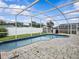 Enjoy this screened pool, with its paver deck and well-manicured landscaping; great for outdoor entertaining at 1112 Winding Water Way, Clermont, FL 34714