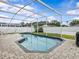 Relax by the pool and enjoy this backyard oasis; the pool has a paver deck and is screened-in at 1112 Winding Water Way, Clermont, FL 34714