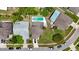 An aerial view shows the property and neighborhood featuring mature trees and landscaping at 11836 Hartfordshire Way, Orlando, FL 32824