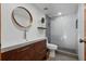 Modern bathroom featuring a vanity with stylish fixtures and a glass-enclosed shower at 11836 Hartfordshire Way, Orlando, FL 32824