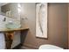 Chic powder room with a glass bowl sink and custom wood countertop at 11836 Hartfordshire Way, Orlando, FL 32824