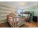 Cozy bedroom with a full-sized bed and bunk bed, perfect for or guests at 11836 Hartfordshire Way, Orlando, FL 32824