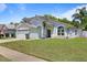 Charming single-Gathering home boasting mature landscaping and well-maintained lawn at 11836 Hartfordshire Way, Orlando, FL 32824
