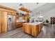 Spacious kitchen featuring modern appliances, custom cabinets and a large island at 11836 Hartfordshire Way, Orlando, FL 32824