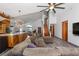 Open-concept living space with a modern kitchen and comfortable seating area at 11836 Hartfordshire Way, Orlando, FL 32824
