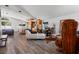 Modern living space with wood flooring, comfortable seating and unique decor at 11836 Hartfordshire Way, Orlando, FL 32824
