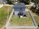 Aerial view of backyard featuring a pergola and a privacy fence at 146 E 15Th St, Apopka, FL 32703