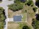 Aerial view of a home showcasing a backyard with a well maintained lawn and a full perimeter fence at 146 E 15Th St, Apopka, FL 32703