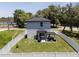 Aerial view of fenced backyard with patio and landscaping with modern two-story home at 146 E 15Th St, Apopka, FL 32703