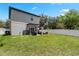 The backyard has a well-maintained lawn, a pergola and a full privacy fence at 146 E 15Th St, Apopka, FL 32703