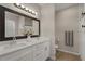 Modern bathroom featuring double vanity, large mirror, and tiled floors at 146 E 15Th St, Apopka, FL 32703