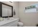 Clean bathroom featuring modern vanity, mirror, and natural light at 146 E 15Th St, Apopka, FL 32703