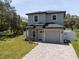Charming two-story home with well-maintained landscaping and brick driveway at 146 E 15Th St, Apopka, FL 32703