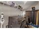 Well-equipped laundry area with modern washer and dryer and convenient storage shelving for supplies at 146 E 15Th St, Apopka, FL 32703