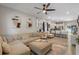 Open-concept living room featuring modern ceiling fan, neutral walls, and stylish decor at 146 E 15Th St, Apopka, FL 32703