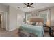 Comfortable main bedroom with carpeted floors, natural light, and ensuite bathroom access at 146 E 15Th St, Apopka, FL 32703