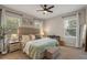 Relaxing main bedroom with plenty of natural light, a ceiling fan, and carpeted floors at 146 E 15Th St, Apopka, FL 32703