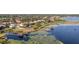 An aerial view showing a community with beautiful homes with private pools, landscaping, and lake access with private docks at 14724 Avenue Of The Rushes, Winter Garden, FL 34787